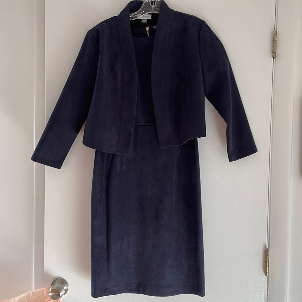 Two piece ultra shade fabric dress by Calvin Klein in size 6. Navy blue